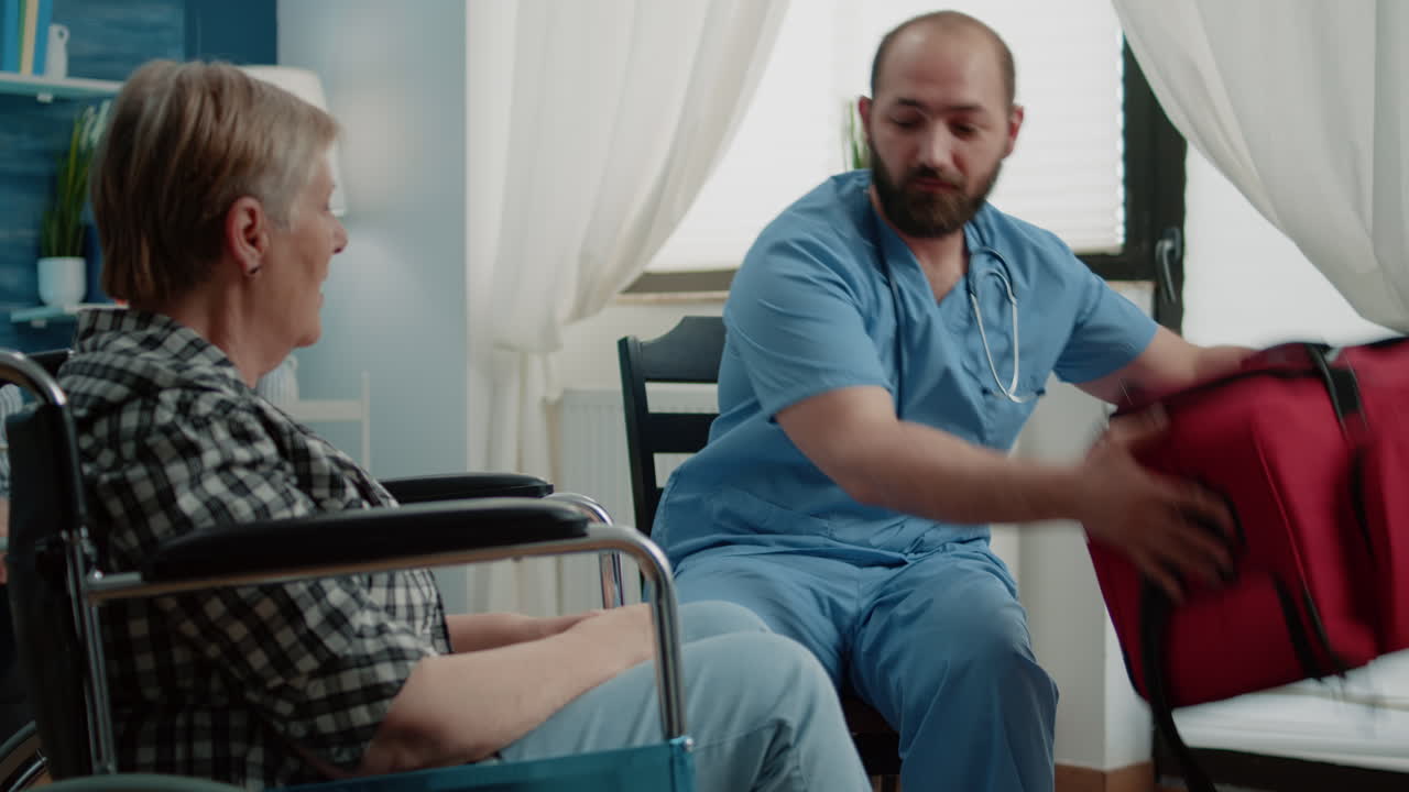 Senior woman in wheelchair getting medical visit at nursing home