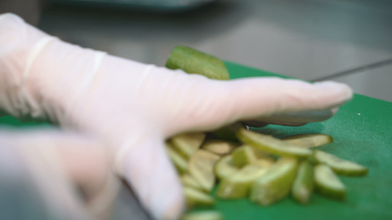 Chef cooking food. Close up view of hands cutting vegetables in the kitchen