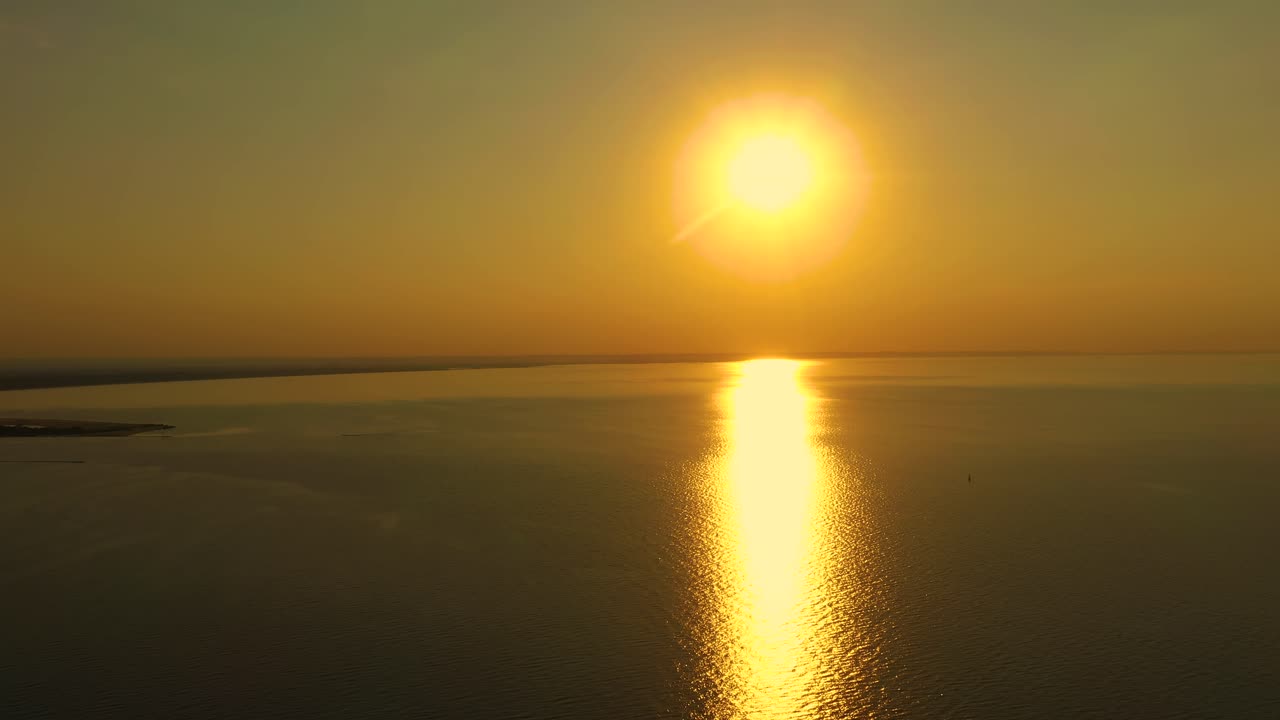 Aerial view over the delta of the Vistula to the Baltic Sea at sunse. Mikoszewo, Jantar