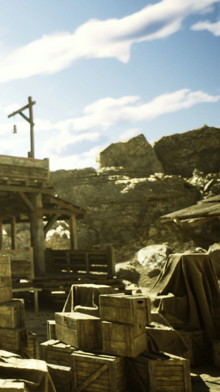 Old western town with wooden crates under a bright blue sky