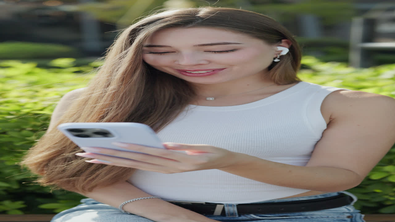Woman using her phone outdoors