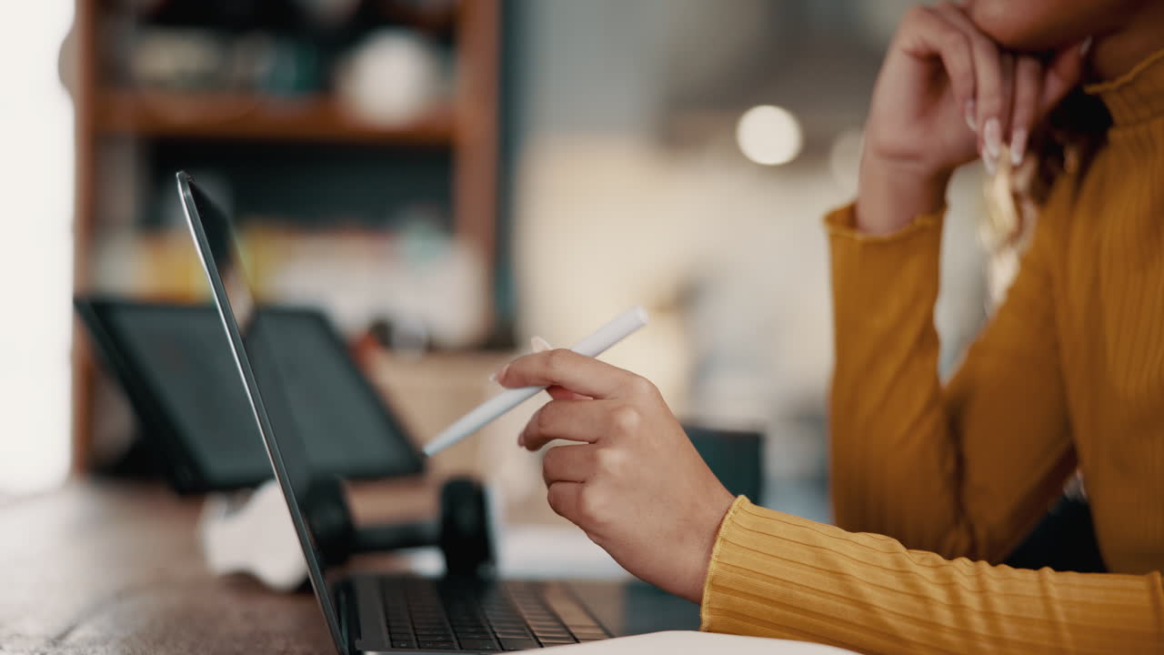 Woman Working on Laptop with Stylus Pen