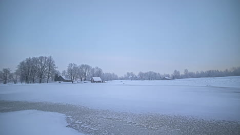 Timelapse-Over-Tranquil-Lake-On-A-Sunny-Sunrise-And-Freezing-Winter