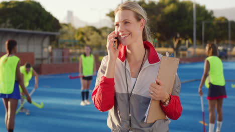 Beautiful-young-woman-hockey-coach-using-her-phone