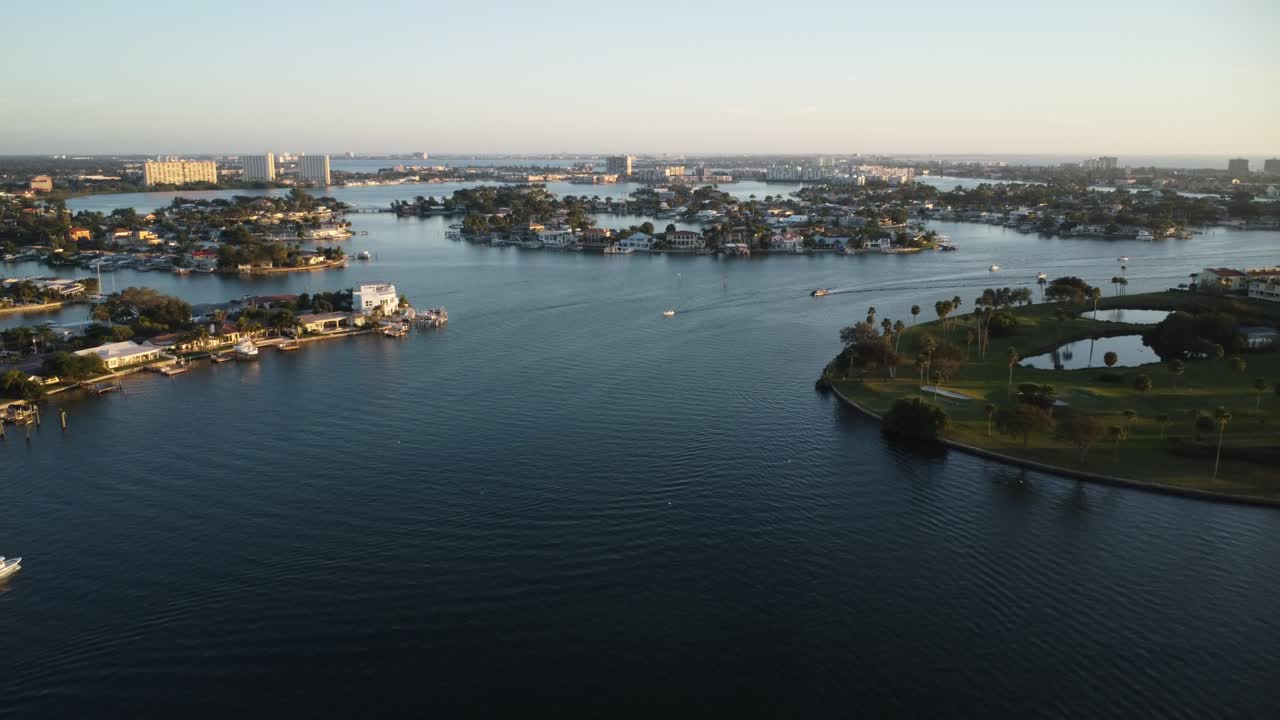 Aerial View of Luxurious Waterfront Homes and Golf Course at Sunrise