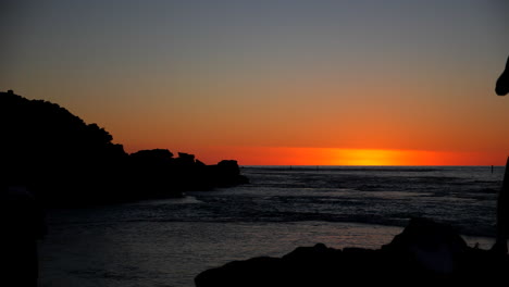 picturesque sunset at beach with people