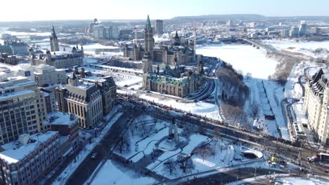 A-view-of-the-downtown-Ottawa-during-winter,-Canada-people-protesting-outside-of-government-buildings-like-parliament-and-the-supreme-court