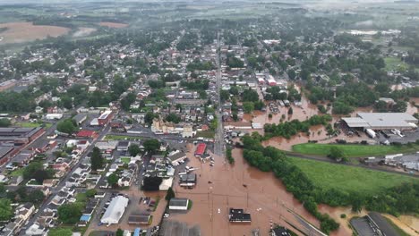 high angle drone shot of flooded american city after heavy hurricane rain. cloudy day in american city. top down flyover. flooding houses and street in district