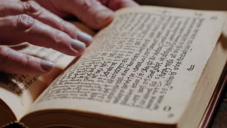 person reading an antique book