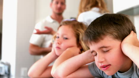 little siblings blocking out noise from parents fighting