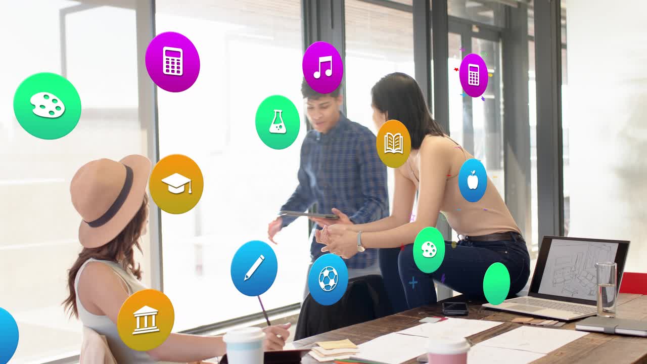 Two women starting discussion at meeting table, education icons floating as man joining with tablet