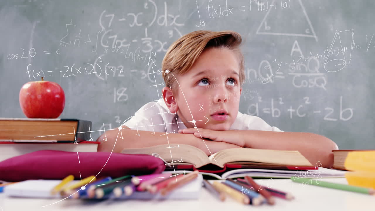 Mathematical equations floating against boy sitting on his desk at school
