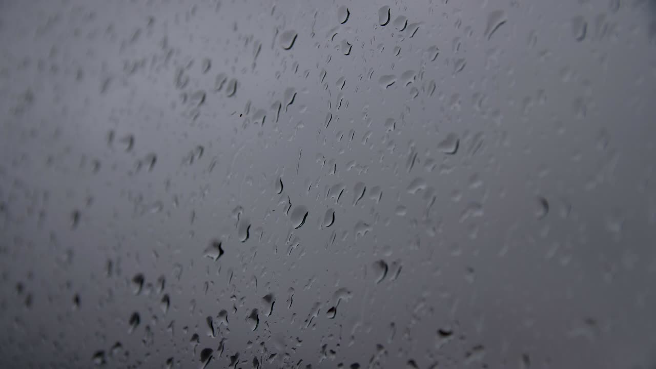 water droplets flow down the glass