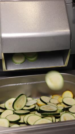 slicing zucchini with commercial food processor