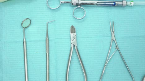 dental instruments on a blue surface