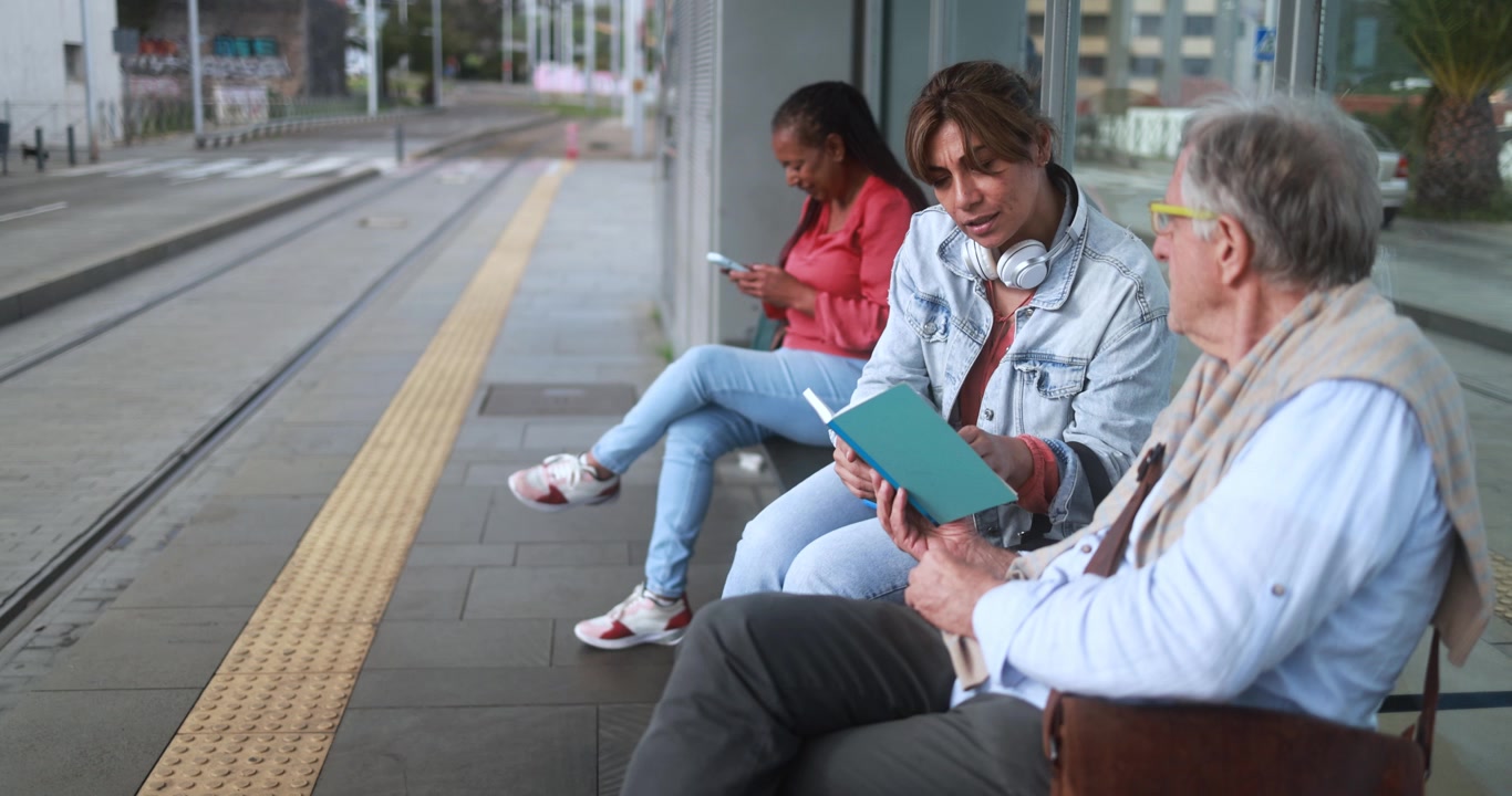 People Waiting at a Tram Station