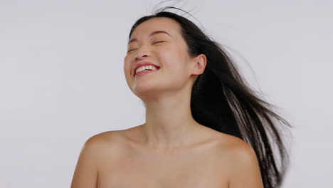 Face,-skincare-and-Asian-woman-with-wind