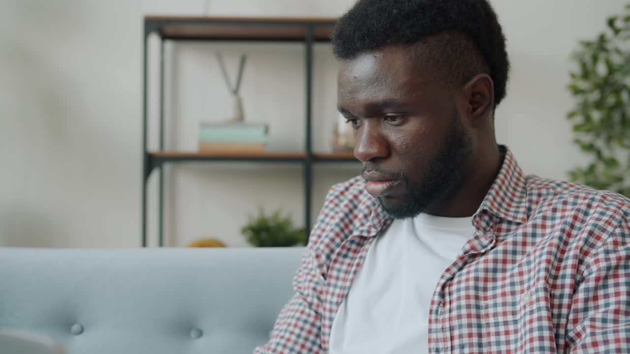 Man Working on Laptop at Home