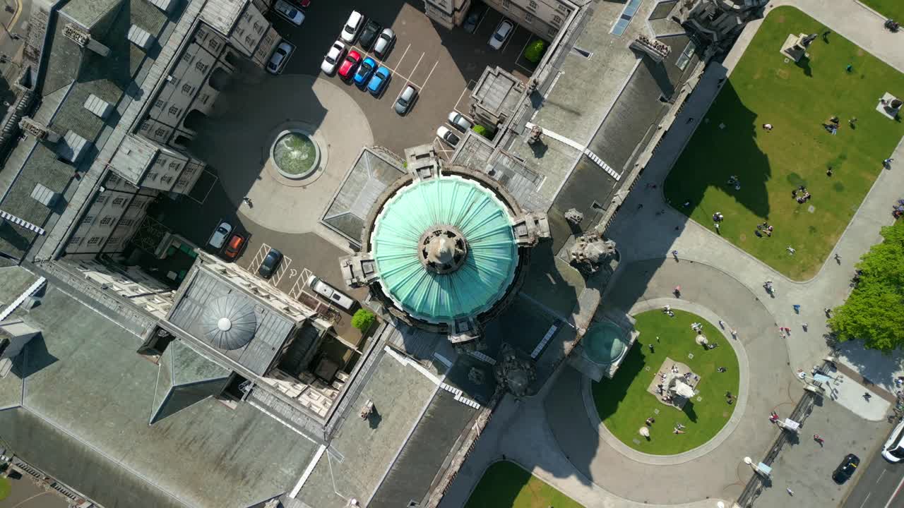 Push-in aerial video of Belfast City Hall in Belfast, Northern Ireland, UK on a bright and sunny day. Filmed in 4K, 60FPS and with Rec709 Color.