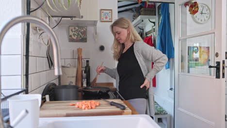 a woman cooking in her kitchen