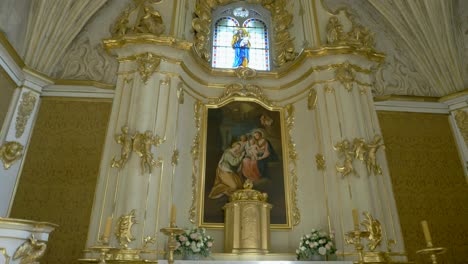 ornate church altar with madonna and child painting