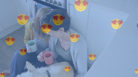 animation of red heart emoji icons over female couple with pet dog