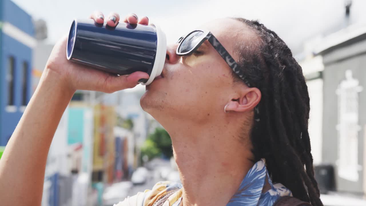 Mixed race man drinking coffee