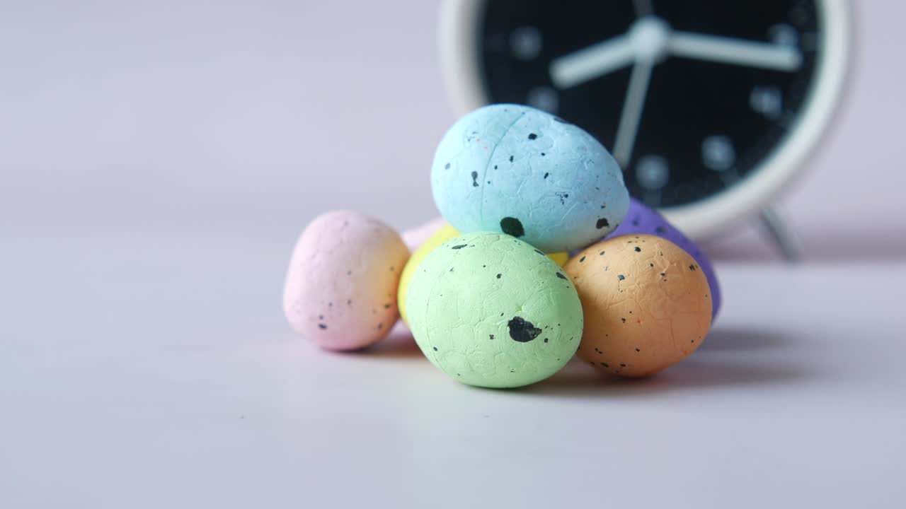 easter concept with egg and a clock on table