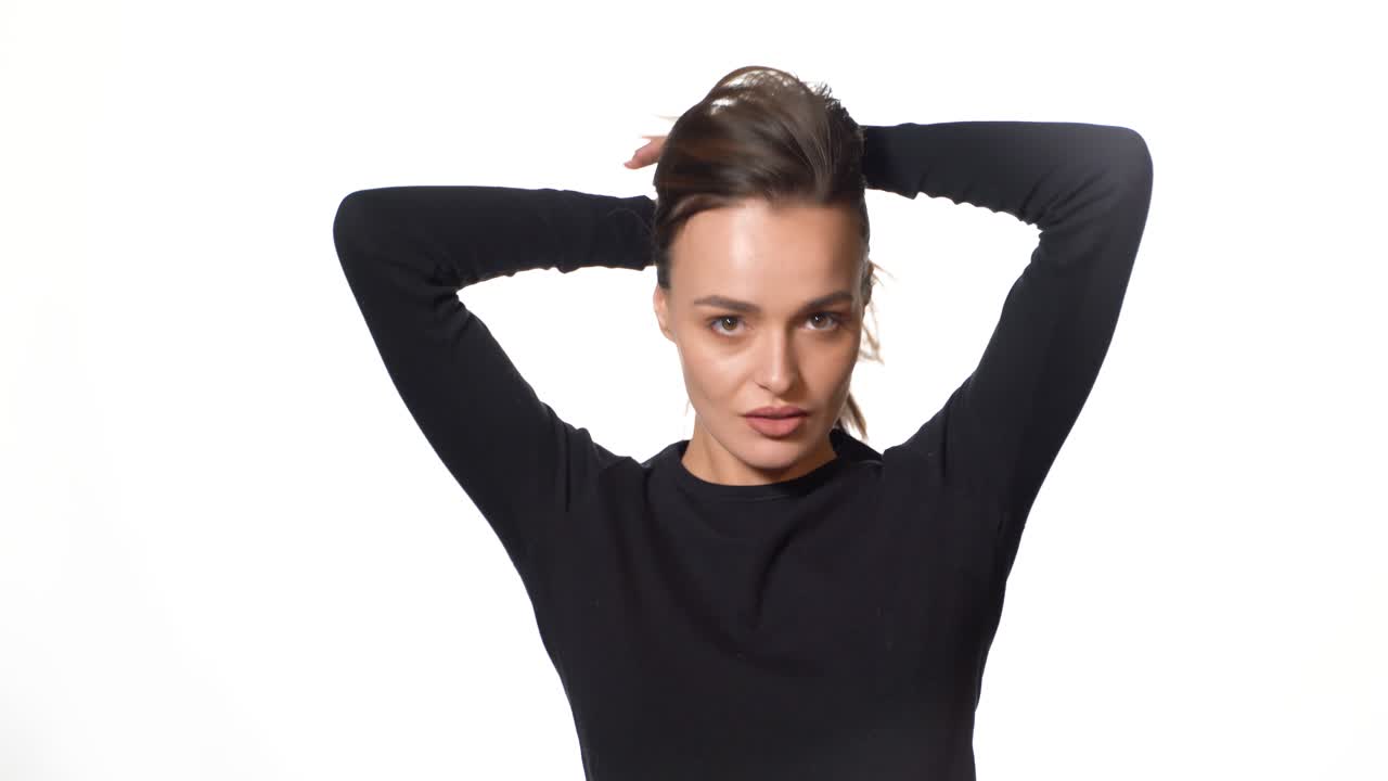 Woman posing isolated on background. Portrait of gorgeous young brunette woman with healthy hair