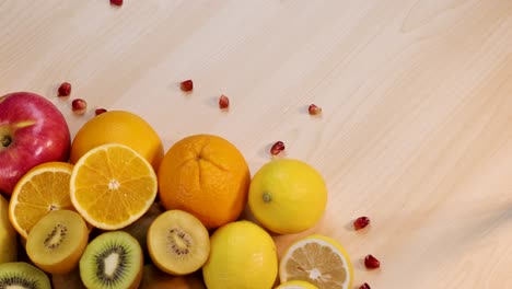 assortment of fresh fruits on wooden table