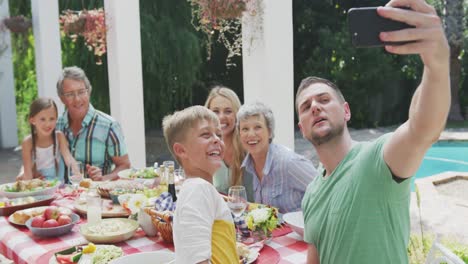 happy family eating together at table