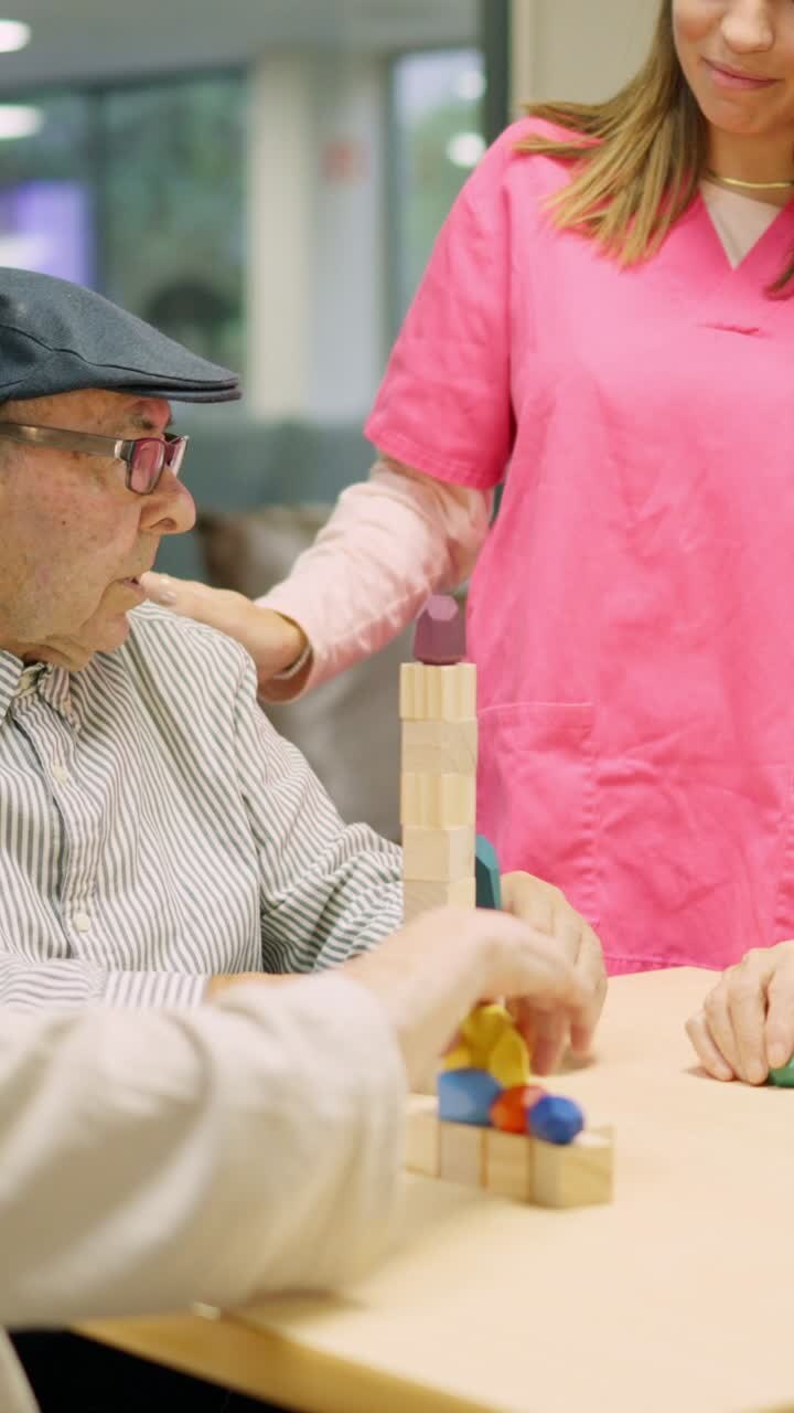 Elderly people playing game with nurse
