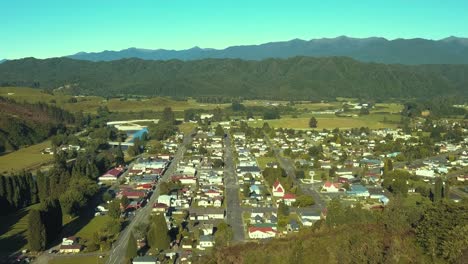 zooming out flyover of reefton new zealand, the town of light and gold mining