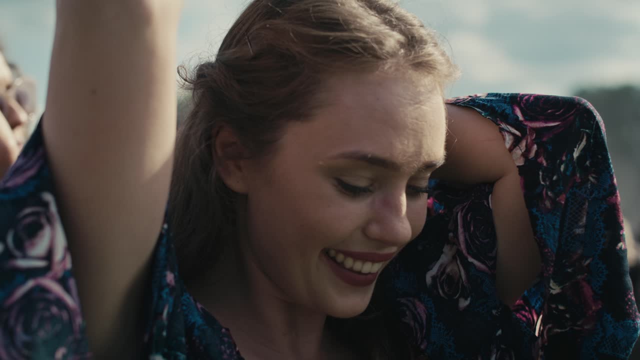Close up of caucasian woman dancing on music festival.