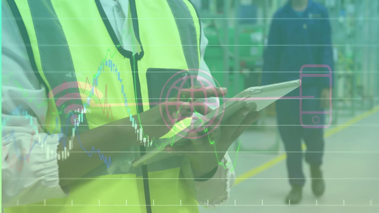 Technicians using tablet and walking on factory floor, showing charts and Wi?Fi icon