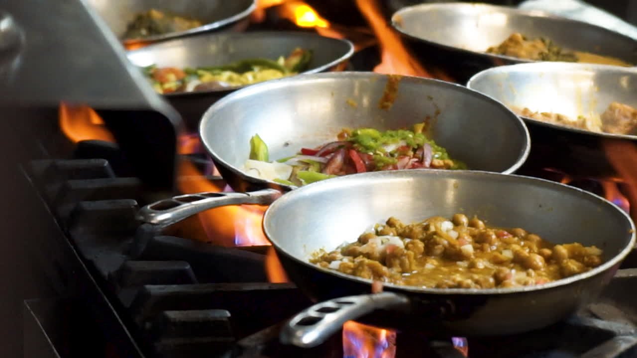 Indian Food Cooking in a Restaurant Kitchen