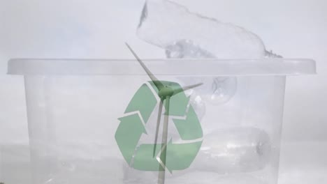 animación de un cartel de reciclaje verde sobre una caja con cajas de plástico y turbina eólica