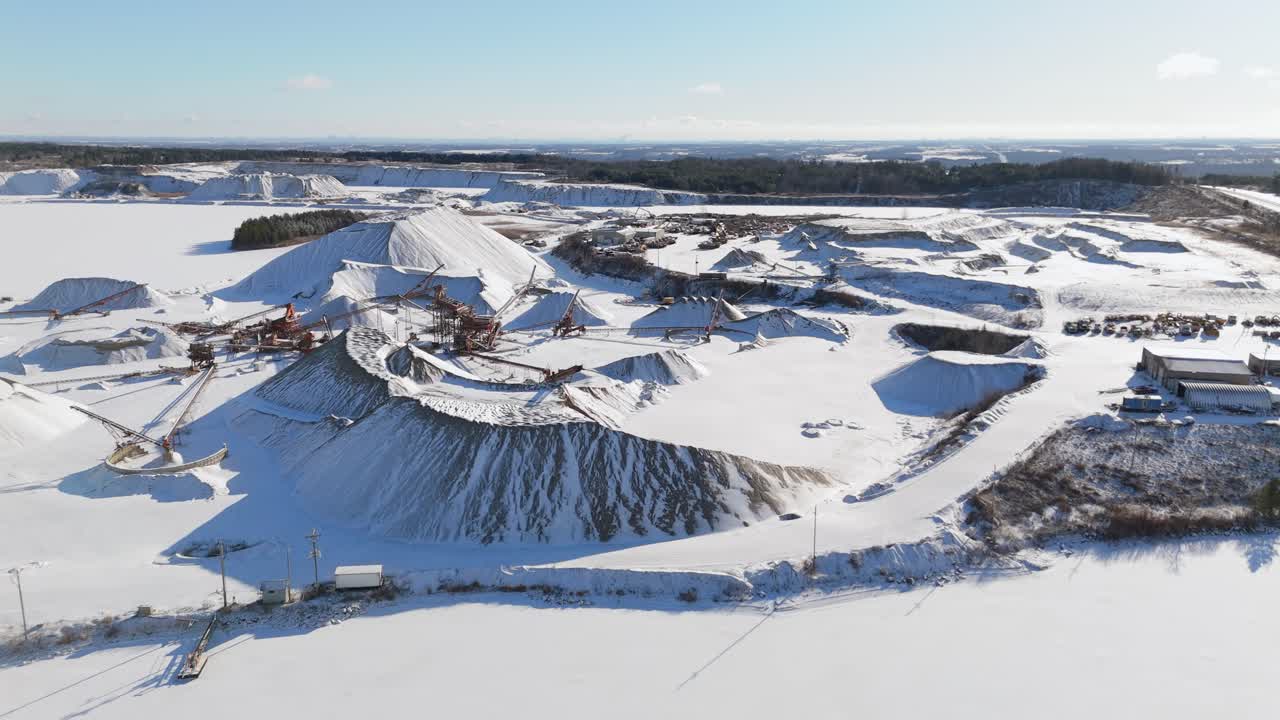 A snowy aerial view of James Dick Quarry in Caledon Village, Ontario, Canada