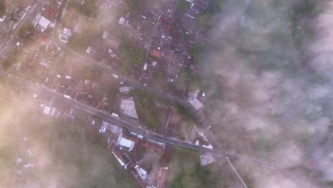 top view through the mist and clouds over the indonesian countryside