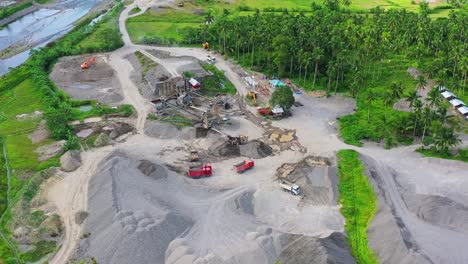 aerial view of gravel pit with green coconut trees in the philippines