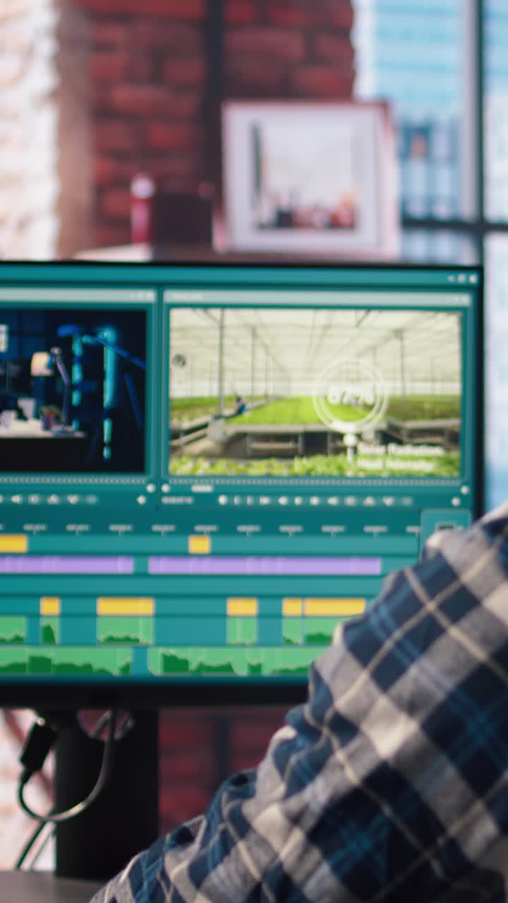 Vertical video Freelancer using editing tools on computer to cut movie project footage