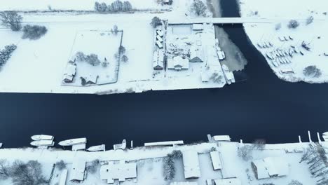 aerial view south side of the village by the river in winter