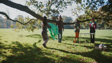 friends celebrating in park