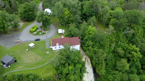 Aerial-View-above-Beautiful-Cascading-Waterfall-in-Town-of-Beaumont,-Quebec