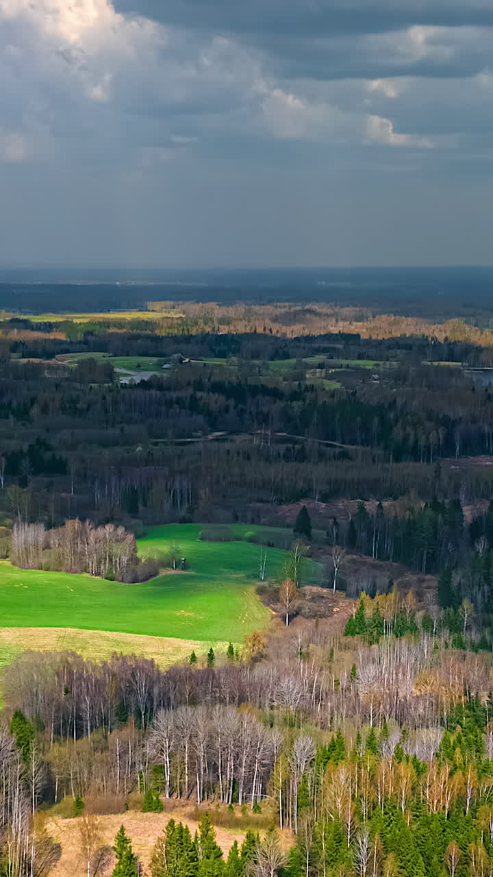 Bright sunlight chased away by fast thick gray clouds. Hyperlapse