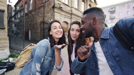 group of friends taking a selfie in the city