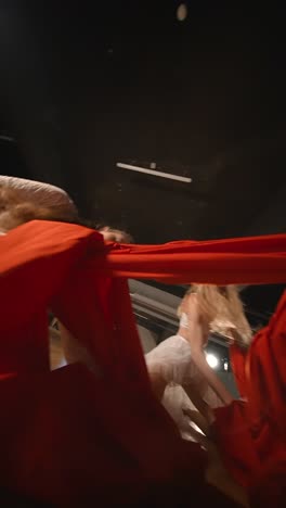 contemporary dance performance with red fabric