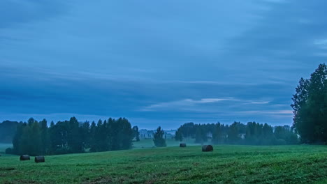 time-lapse of rural landscape shrouded in morning mist