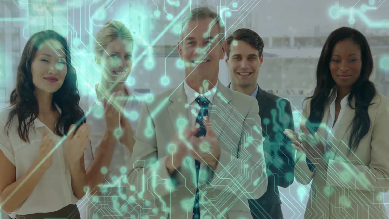 group of business professionals clapping in office with green circuit overlay showing data flow