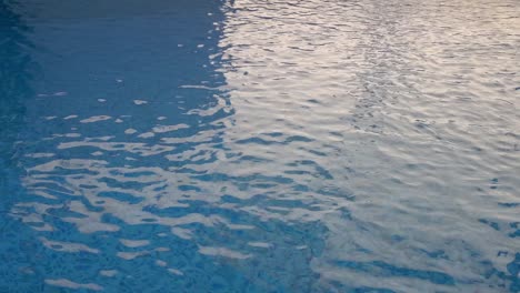 the water swirling on the surface of a swimming pool